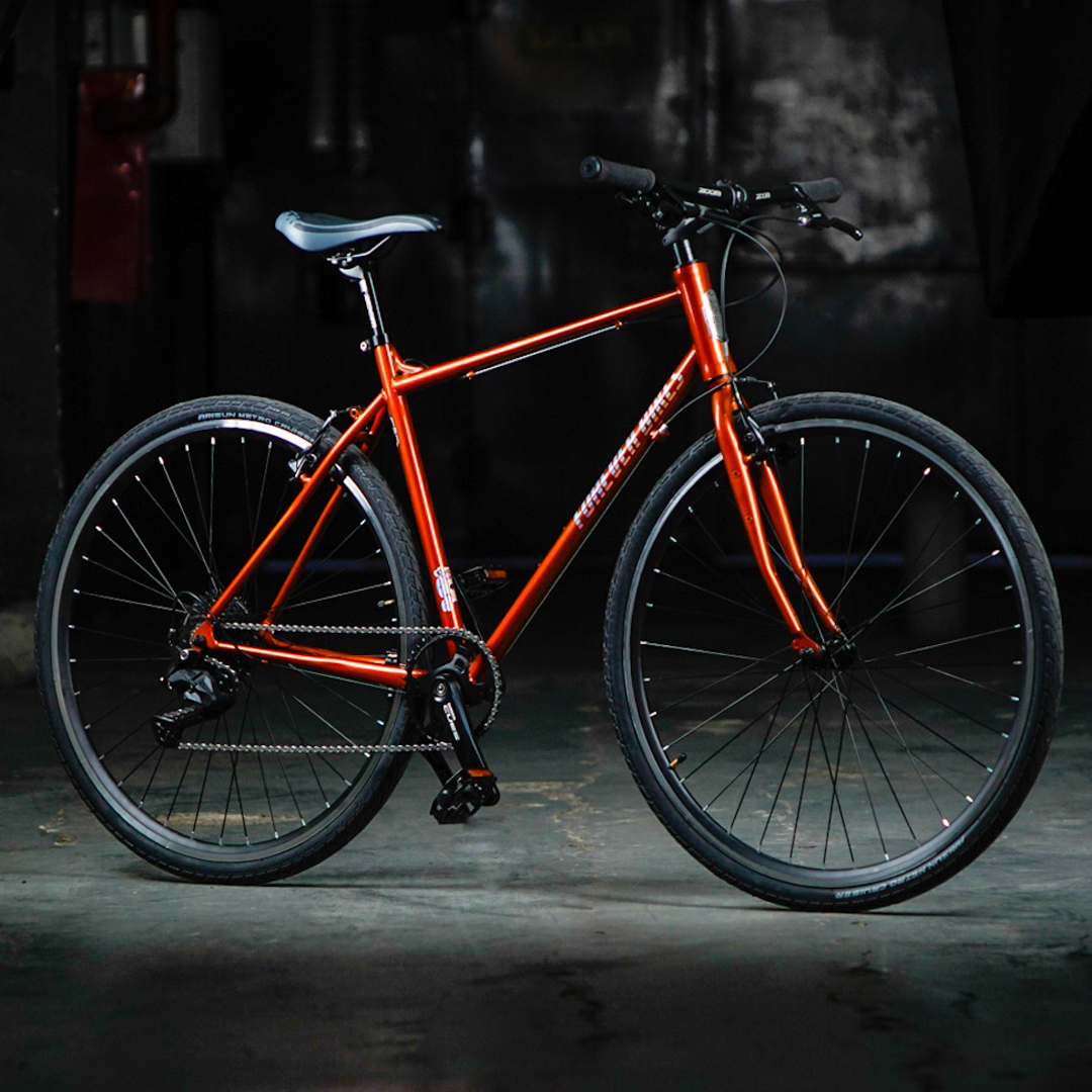 Traveller Naranja Nacar 9 velocidades Shimano CUES Forever Bikes